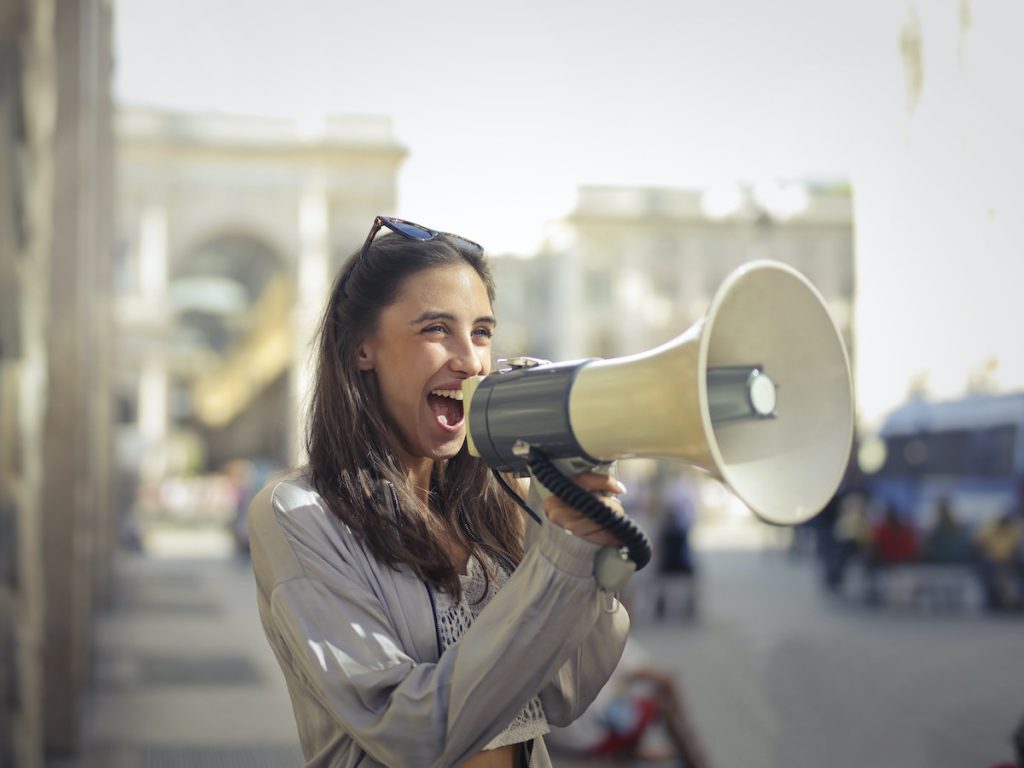 woman cheering with a megaphone